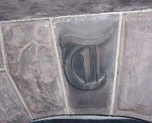 monogramme incrusté dans un foyer; Town of Shediac