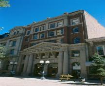 Street-level view of Northern Crown bank from Southwest, 1991.; Government of Saskatchewan, T.J. Sinclair, 1991