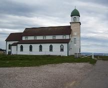 Exterior photo, north facade, Holy Trinity Church, Codroy, Newfoundland, 2006, showing restoration work in progress.; HFNL 2006