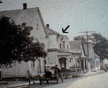 Main Street, Rexton. The sign in front of the hotel says "Rexton Inn".; Village of Rexton