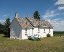 Side elevation with landcaped grounds and prairiescape in background, 2005; Kyle Zelmer, 2005