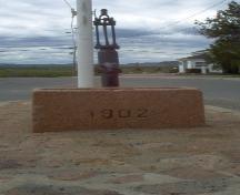 Front view of pump and trough; Norma Stewart