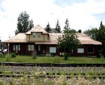 View of station from across railway tracks highlighting the roofline and window locations, 2005.; Saskatchewan Architectural Heritage Society, Kyle Zelmer, 2005