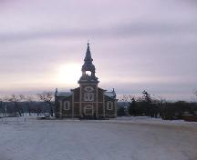 View of church building featuring the tower, steeple and stone detailing, 2005.; Dwayne Yasimowski, 2005.