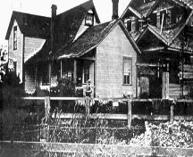The 1st and 2nd Parmiter Houses, while 2nd (at right) was under construction and before the 1st was relocated, circa 1919; Delta Museum and Archives, #1970-1-491