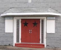 View of doors, glass-block frame and sign boards, 2005.; Government of Saskatchewan, Marvin Thomas, 2005.
