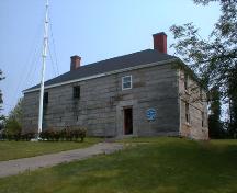 This front elevation includes a door and three window openings on the second level.; PNB 2004