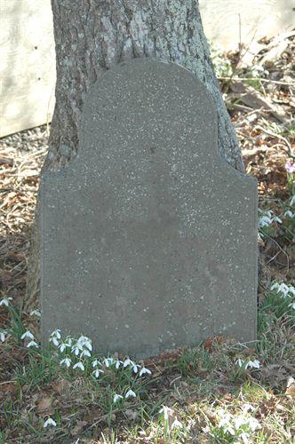 Tombstone on the Harris-Baxter house property