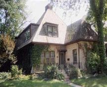 A distinctive hipped roof and prominent dormers highlight this French Cottage style home.; City of Windsor Planning Department
