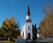View of main facade with tower and of church grounds with large, mature trees growing there.  Photo taken October 17, 2006.; HFNL/ Deborah O'Rielly 2007
