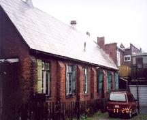View of the south elevation of the rear hall showing buttresses and windows – November 2001; OHT, 2001