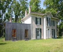 Featured is the main house and the reconstructed board and batten summer kitchen.; Ministry of Culture, 2007.