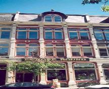 View of main facade showing the building's tall and slender proportions; OHT, 2001