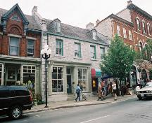 View of façade at 70-72 Princess Street showing proportions and limestone composition – July 2004; OHT, 2004