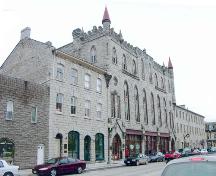View of the façade from the southeast showing location between two stone blocks – December 2004; OHT, 2004