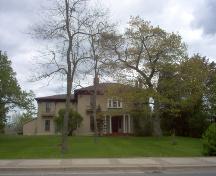 Full front view of house and lawn; Norma Stewart