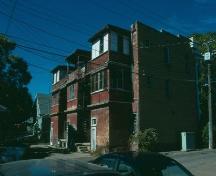 View of enclosed verandas on rear of building, 1988.; Government of Saskatchewan, Frank Korvemaker, 1988