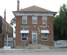View of front of Old Bank of Montreal featuring the symetrical brick façade, 2007.; J. Kasperski, 2007.