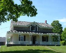 Front view, showing verandah, gable window and front entrance.; RHI 2006