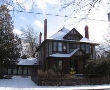 West façade of 73 Heins Avenue depicting one of the entrances to the building and the garage, 2007.; Lindsay Benjamin, 2007.