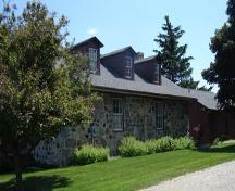 Of note are the dormer windows and fieldstone construction.; Kendra Green, 2007.