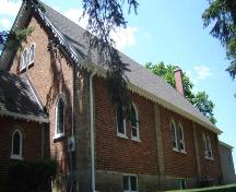 Of note are the steeply-pitched roofline and detailing on the eaves.; Kendra Green, 2007.