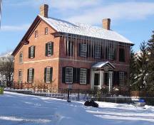 Southwest view of the Wissler House illustrating the structures unique fenestration, 2007.; Kayla Jonas, 2007.
