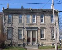 Featured are the three Tuscan-style pilasters and classic entablature which frame the entrance.; Lindsay Benjamin, 2007.