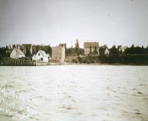 Poole House on left above wharves and stores; Donna Collings Collection