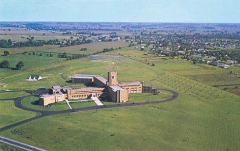 Postcard showing aerial image of building