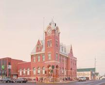 Corner view of the Humboldt Post Office, showing two prominent facades joined by a large four-storey clock tower.; Parks Canada Agency / Agence Parcs Canada.