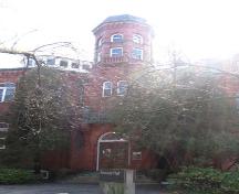Featured is the octagonal central turret and arched entranceway.; Lindsay Benjamin, 2007.