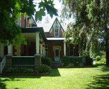 Featured is the Gothic Revival wing of the house, with central gable and lancet window.; Kayla Jonas, 2007.