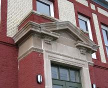 View of the Cable Building, showing the entrance with triangular pediment, 2006.; Parks Canada Agency / Agence Parcs Canada, N. Miquelon, 2006.
