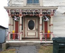 This photograph shows the wood panelled door, sidelights and the large portico over the entrance, 2006; City of Saint John