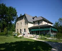 View from the northeast of the gardens and secondary elevations of the Captain William Kennedy House, Lockport area, 2005; Historic Resources Branch, Manitoba Culture, Heritage, Tourism and Sport, 2005