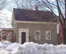 650 Charlotte Street, front view showing simple exterior and recent porch addition; City of Fredericton
