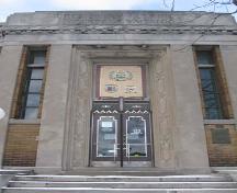 Featured are the double-leaf bronze and glass front doors, and the limestone architrave, 2007.; Lindsay Benjamin, 2007.