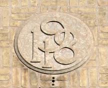 Detail of the date stone on the Julia Clark School, Winnipeg, 2007; Historic Resources Branch, Manitoba Culture, Heritage, Tourism and Sport, 2007