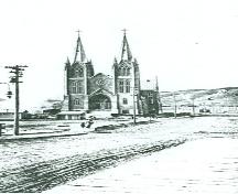 General view of St. Patrick, showing its location, slightly set back from the street, 1914.; Parks Canada Agency / Agence Parcs Canada, 1914.