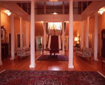 Interior view of Government House, showing its centre hall and large staircase, 1995.; Parks Canada Agency / Agence Parcs Canada, J. Butterhill, 1995.