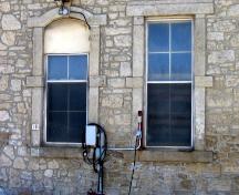 Featured are the carved stone window surrounds and randomly-coursed limestone wall.; Mary Tivy, 2008.
