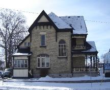 Of note is the large semi-circle stained glass window on the east elevation.; Kayla Jonas, 2008.