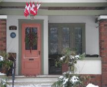 Of note are the covered front entrance and brick piers.; Kayla Jonas, 2008.