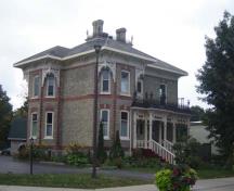 Of note is the front veranda with scrollwork and iron cresting.; Kayla Jonas, 2007.