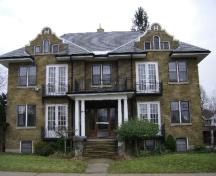 Of note is the front entrance, protected by a simple porch.; Kayla Jonas, 2007.