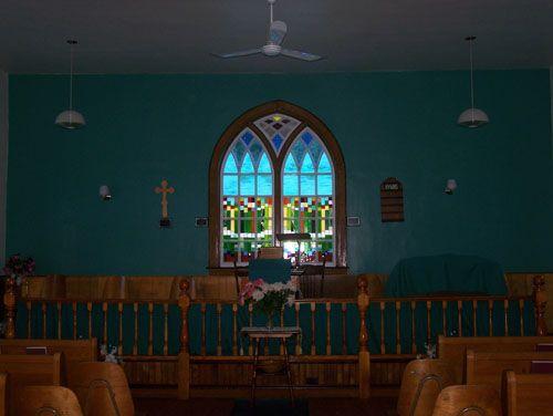 Altar and stained glass window from the interior