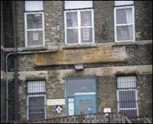 Featured is the name “Military Stores” inscribed on the facade.; Emily Elliot, 2007.