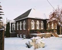 This view of the Trudel Residence illustrates the prominent southwest corner facing Jasper Avenue, and the elegant west entrance portico. (2004); City of Edmonton, 2004