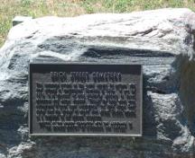 Featured is the plaque commemorating the early settlers who are interred at the cemetery.; Kendra Green, 2007.